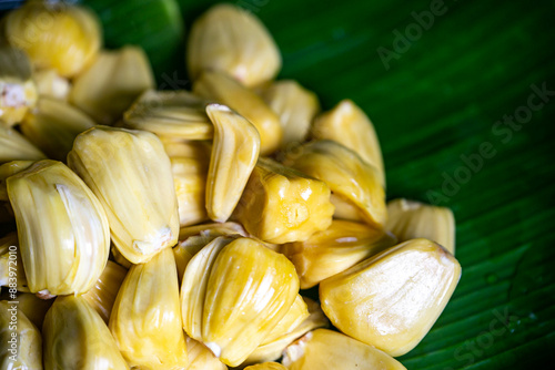 Background image of jackfruit being peeled off to be eaten. photo