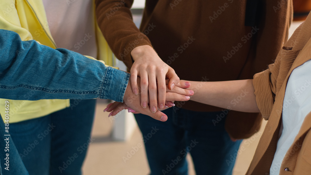 Cropped view many arms stack hands buddies cooperation unity teamwork Caucasian students girls females friends schoolgirls guys boys males schoolboys in high school university college smile friendship Cropped view many arms stack hands buddies cooperation unity teamwork Caucasian students girls females friends schoolgirls guys boys males schoolboys in high school university college smile friendship