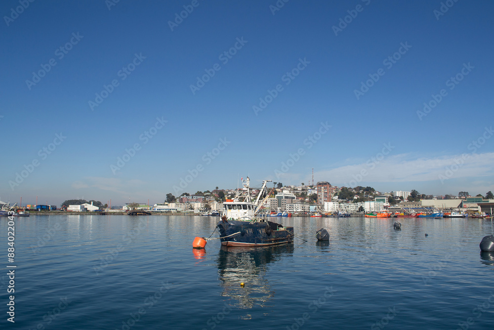 a fishing boat in a port in southern Chile a fishing boat in a port in southern Chile