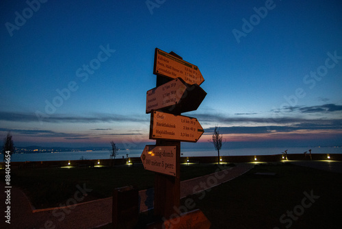 Sunrise on the shore and harbor of a lake in summer. Colorful sky with a wide view of the Horiont. Nature landscape at Tihany marina, Balaton, Lake Balaton, Siófok, Hungary photo