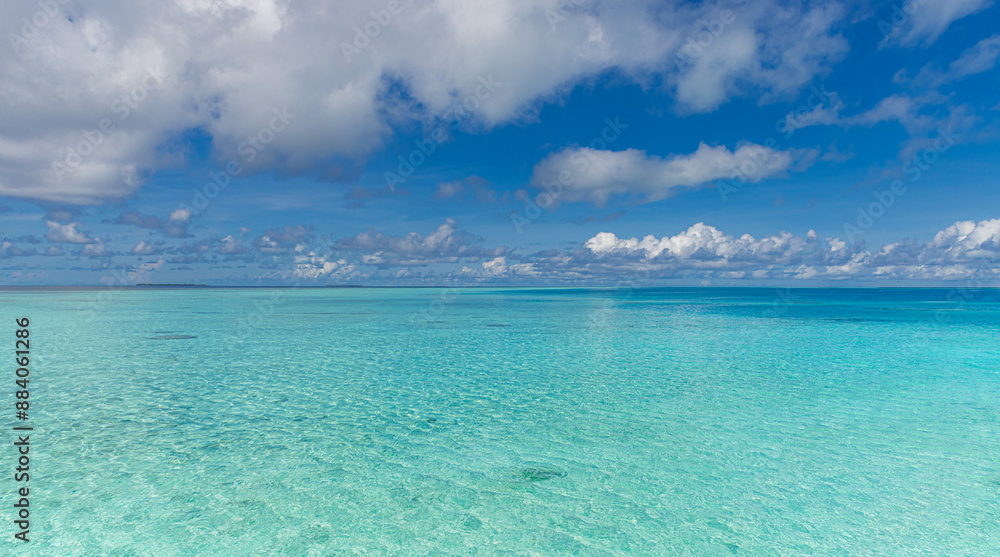 Beautiful summer sea. Sunny exotic tropical beach. Nature horizon sea and bright blue sky with clouds with sunlight. Summertime seascape, turquoise ocean water, idyll island meditation, inspire Beautiful summer sea. Sunny exotic tropical beach. Nature horizon sea and bright blue sky with clouds with sunlight. Summertime seascape, turquoise ocean water, idyll island meditation, inspire