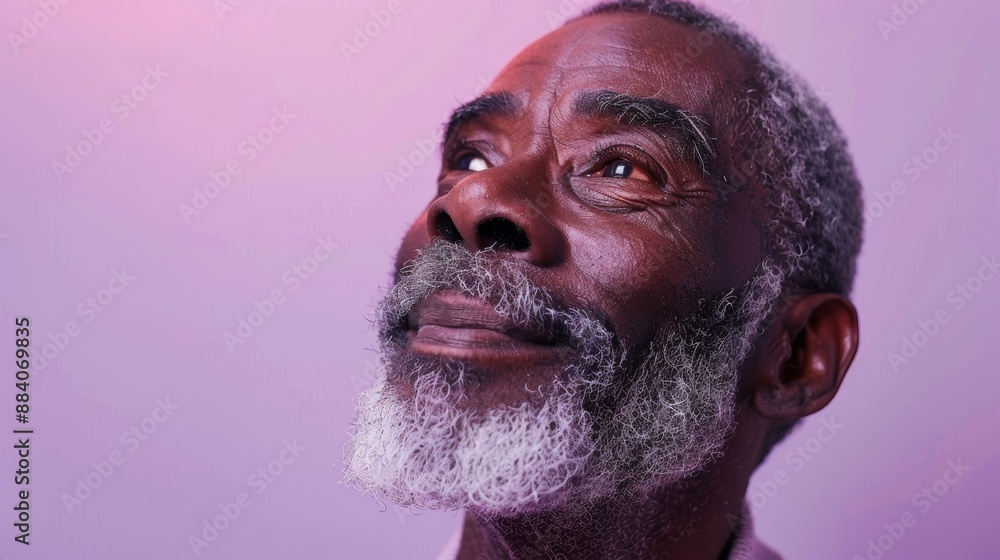 Funny black man laughing on studio background for humor, happiness, or wellness. A happy, smiling, older black model with a grey beard for masculine attractiveness, cosmetics, and confidence. Funny black man laughing on studio background for humor, happiness, or wellness. A happy, smiling, older black model with a grey beard for masculine attractiveness, cosmetics, and confidence.