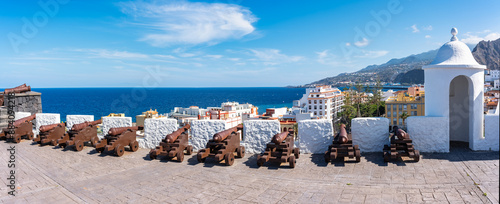 Row of medieval city defense cannons in Santa Cruz de la Palma, Canary Islands. photo