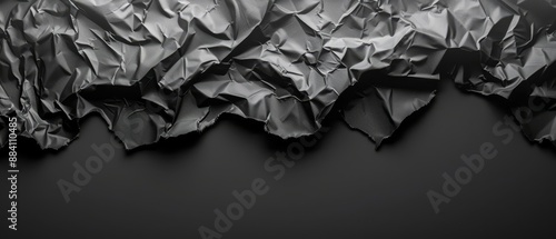  A monochrome image of creased paper resembling a mountainfold © Jevjenijs