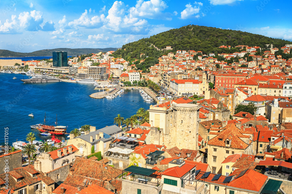 Coastal summer cityscape - top view of the Old Town and harbor of Split on the background of the Marjan hill, the Adriatic coast of Croatia Coastal summer cityscape - top view of the Old Town and harbor of Split on the background of the Marjan hill, the Adriatic coast of Croatia