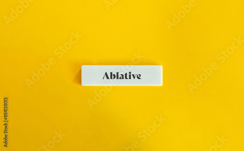 Ablative Case. Text on Block Letter Tile on Yellow Background. Minimalist Aesthetics. photo