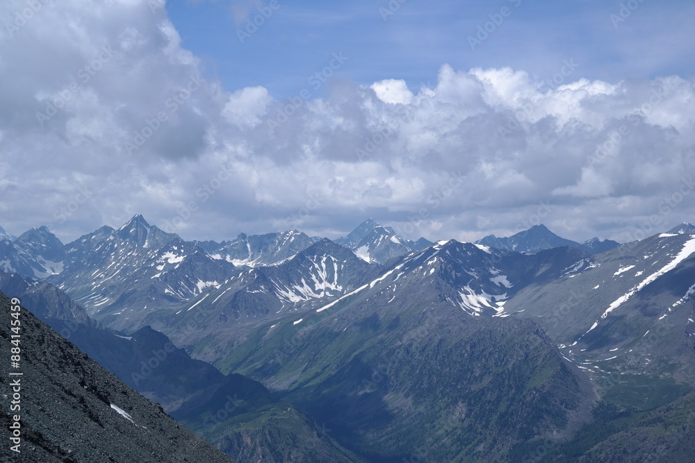 A breathtaking view of a rugged mountain landscape with majestic snow-capped peaks, deep valleys, and a serene blue sky, ideal for outdoor adventure and nature lovers. A breathtaking view of a rugged mountain landscape with majestic snow-capped peaks, deep valleys, and a serene blue sky, ideal for outdoor adventure and nature lovers.