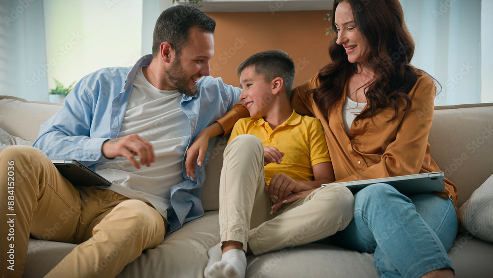 Happy Caucasian family mom dad son parents child kid boy tickling having fun relax on sofa together talking speak cuddle laugh play cuddling loving relationship concept new comfortable home apartment Happy Caucasian family mom dad son parents child kid boy tickling having fun relax on sofa together talking speak cuddle laugh play cuddling loving relationship concept new comfortable home apartment
