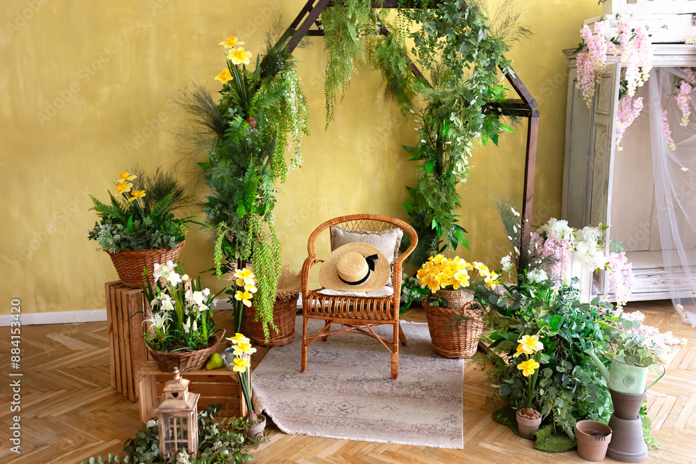 Interior of a wooden greenhouse with rattan chair. Plants and flowers growing in small wooden greenhouse. Wooden rustic arch style, different garden tools and pots. Gardening at home. Wedding decor Interior of a wooden greenhouse with rattan chair. Plants and flowers growing in small wooden greenhouse. Wooden rustic arch style, different garden tools and pots. Gardening at home. Wedding decor