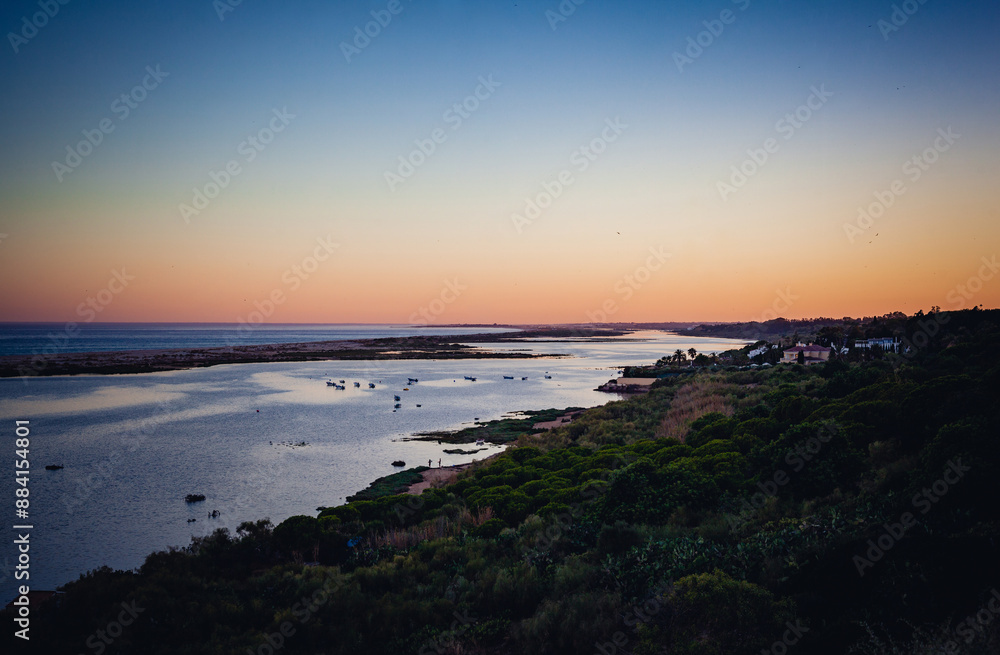 Cacela Velha beach in Algarve at the sunset in the summer Cacela Velha beach in Algarve at the sunset in the summer