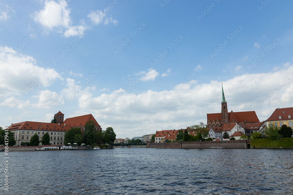 View of the houses on Tumski Island across the river Odra in Wroclaw. Poland View of the houses on Tumski Island across the river Odra in Wroclaw. Poland