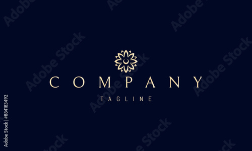 A vector golden logo with an abstract image of a bud of a blossoming wildflower.