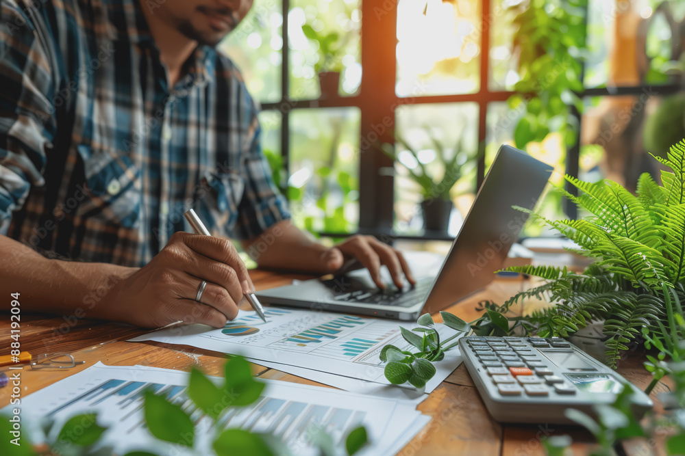 Hand man doing finances and calculate on desk about cost at home office. Hand man doing finances and calculate on desk about cost at home office.