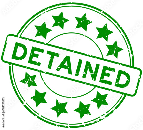 Grunge green detained word round rubber seal stamp on white backgroundr