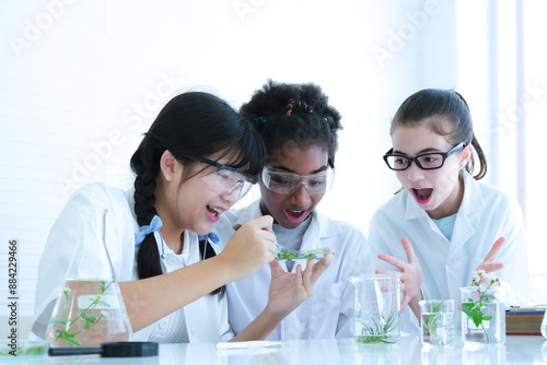 Young girls of multi races are happy and excited about the results of science experiments in the lab.