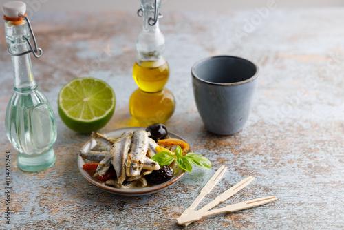 anchovy appetizer with olives.