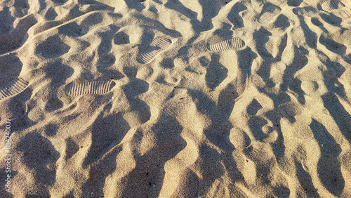 sand beach texture background with foot steps