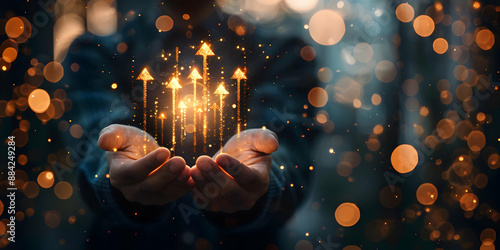 Fototapeta Naklejka Na Ścianę i Meble -  A pair of hands holding magical glowing arrows rising upwards, symbolizing growth, progress, and success in a blurred background with bokeh lights.