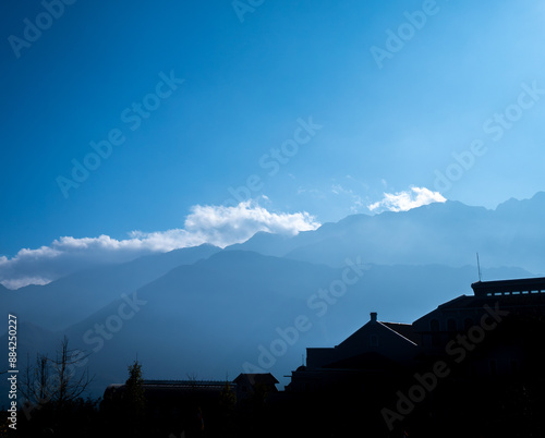 Silhouette Buildings behind The Mountains