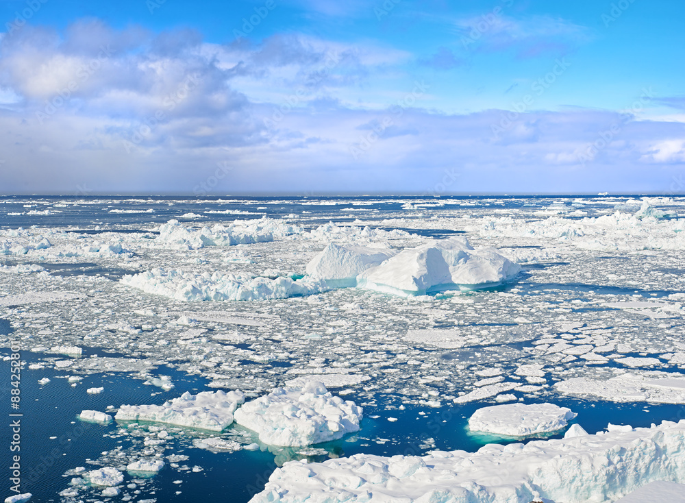 Obraz premium Nature, iceberg or ocean water with snow, clouds or sky outdoor in Greenland. Arctic, sea or melting ice caps in environment with glacier for climate change crisis or global warming problem in winter