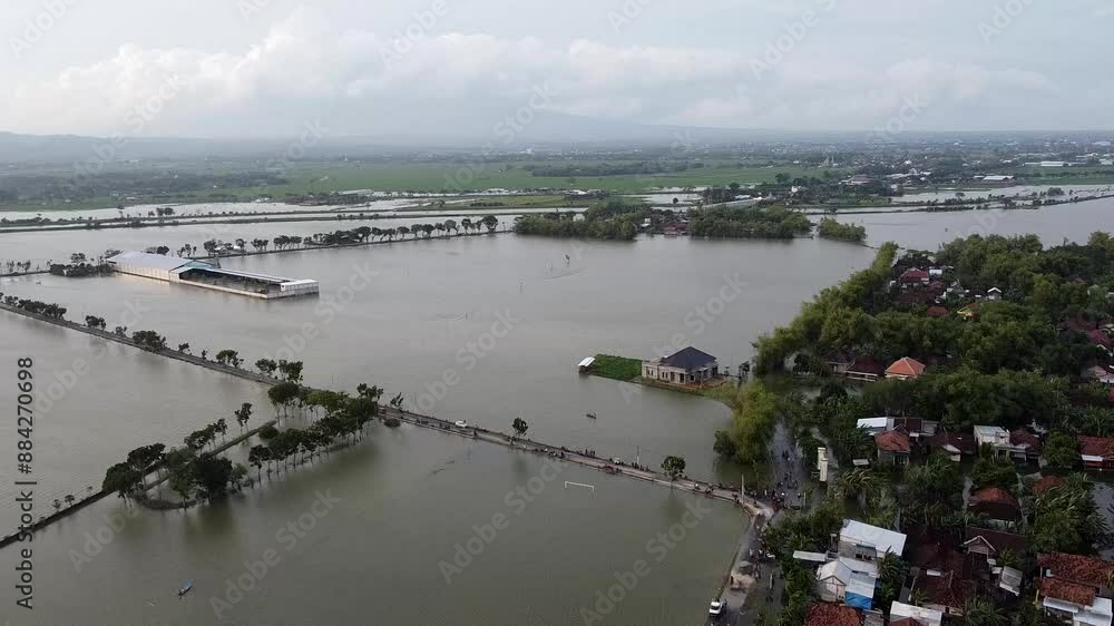 Aerial view of flooded area with submerged roads and buildings Aerial view of flooded area with submerged roads and buildings