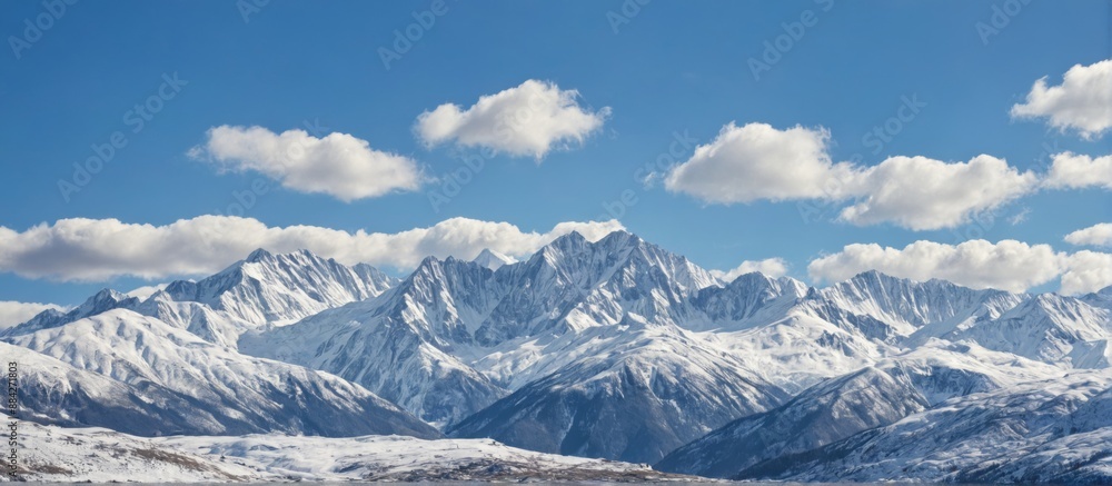 Naklejka premium landscape photograph mountain range sky blue few white
