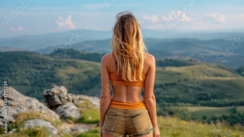 Wallpaper Mural Fit Woman Hiking Through Rugged Mountains Exploring Nature's Beauty with Strength and Determination, An Inspiring Journey of Athleticism and Adventure Torontodigital.ca