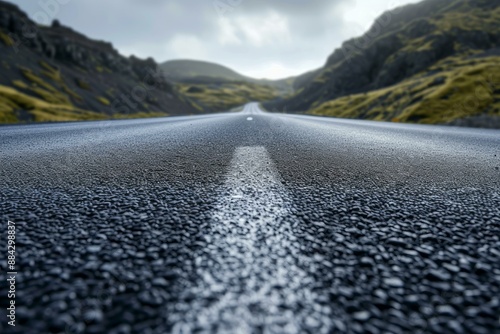 Wallpaper Mural Close-up of a desolate road leading towards a mountain range under a cloud-filled sky Torontodigital.ca