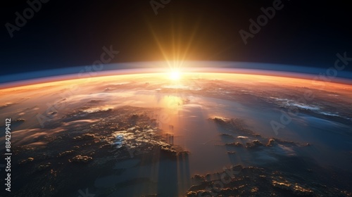 Golden sunrise casting light over Earth's surface from space