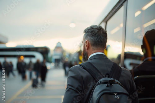 Businessman Commuting with Backpack at Bus Station