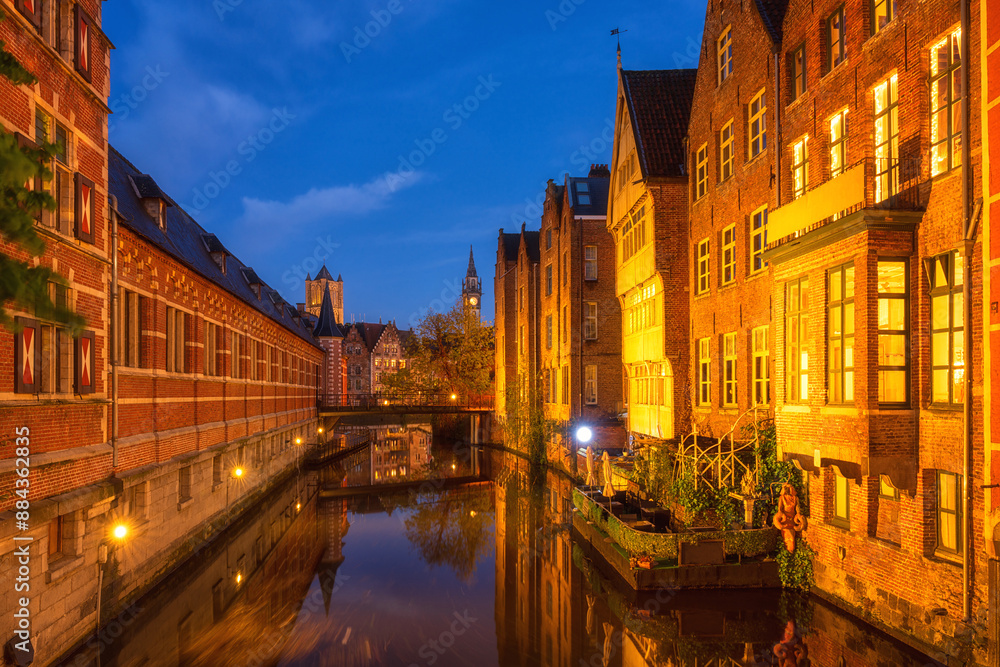 Scenic view of the historic city center of Ghent (Gent), Belgium. Beautiful cityscape with medieval architecture, monumental landmarks and water with reflection at twilight, outdoor travel background Scenic view of the historic city center of Ghent (Gent), Belgium. Beautiful cityscape with medieval architecture, monumental landmarks and water with reflection at twilight, outdoor travel background