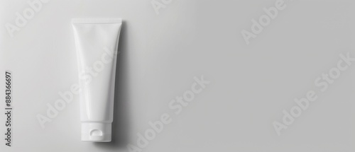 A white tube of toothpaste is sitting on a white background