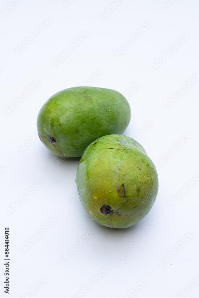 Fresh mango fruit on a white background, highlighting its vibrant yellow color and smooth texture, perfect for food photography and advertising Fresh mango fruit on a white background, highlighting its vibrant yellow color and smooth texture, perfect for food photography and advertising