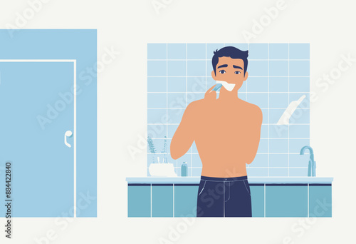 Man Brushing Teeth in Bathroom