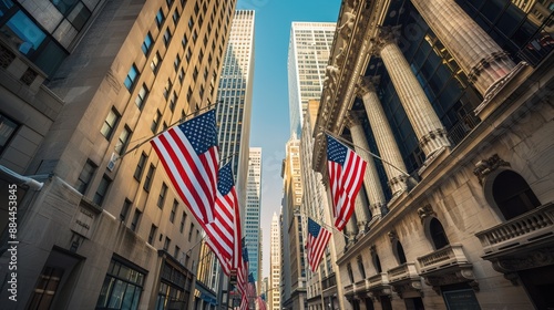A city street with many buildings and a few American flags flying