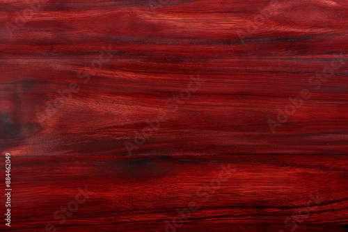 A close up of a red wood grain