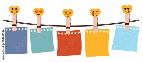 Cute clothes pegs with smiley hearts and a set of colourful paper leaves for notes. Colourful paper hanging on a string