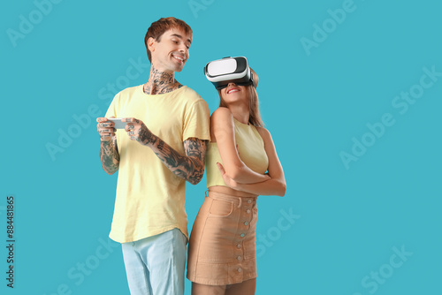 Young couple with VR glasse...