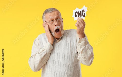 Shocked senior man holding ...