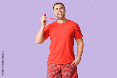 Happy young lifeguard with ...