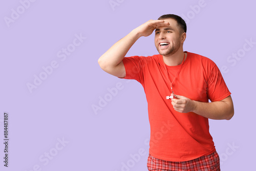 Happy young lifeguard with ...