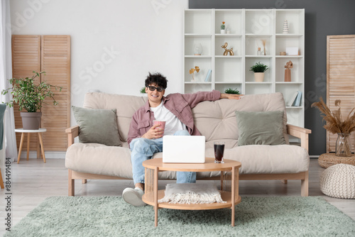 Young man in 3d eyeglasses ...
