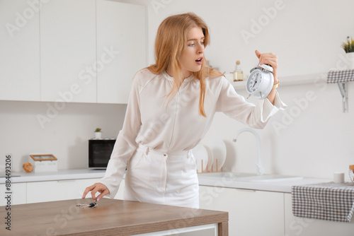 Hurrying young woman with k...