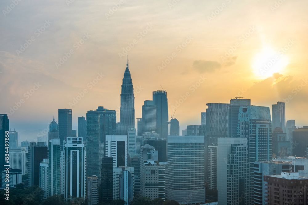 Kuala Lumpur city skyline with high-rise buildings and skyscrapers at sunrise, Malaysia. Cityscape of Asian city with modern architecture. Travel and tourism background Kuala Lumpur city skyline with high-rise buildings and skyscrapers at sunrise, Malaysia. Cityscape of Asian city with modern architecture. Travel and tourism background