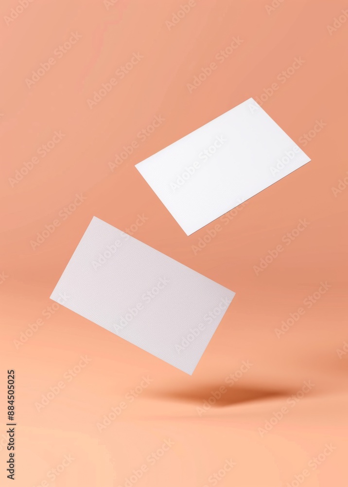 Mockup of White Blank Business Cards Floating on Peach Background Mockup of White Blank Business Cards Floating on Peach Background