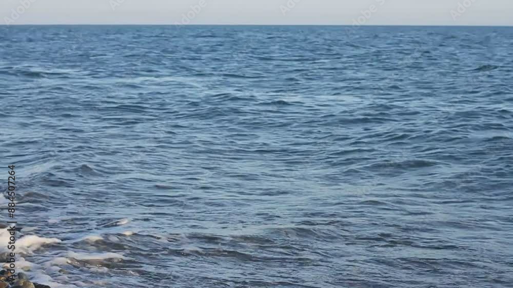 Sea wave crashing on the shore. Evening sunset on the Black Sea. Sea wave crashing on the shore. Evening sunset on the Black Sea.