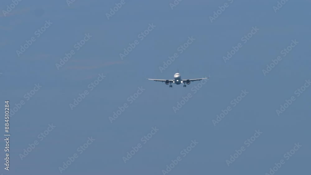 Passenger flight arriving. Jet commercial aircraft with an unrecognizable livery approaching landing, bottom view. Travel concept Passenger flight arriving. Jet commercial aircraft with an unrecognizable livery approaching landing, bottom view. Travel concept