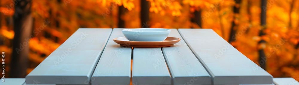 Empty plate on a wooden table with autumn leaves background. Empty plate on a wooden table with autumn leaves background.