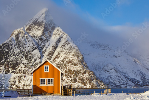 Scenic winter landscape of Lofoten with traditional Rorbu cabin photo