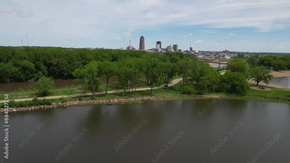DES MOINES - 6.24.2024 - Very good aerial view lifting from Grays Lake towards downtown Des Moines, Iowa. DES MOINES - 6.24.2024 - Very good aerial view lifting from Grays Lake towards downtown Des Moines, Iowa.